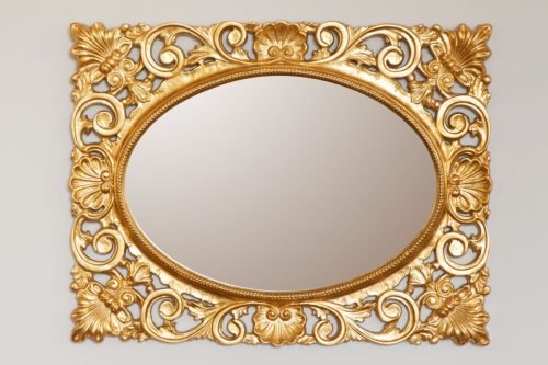 20542349 - golden mirror frame on the wall